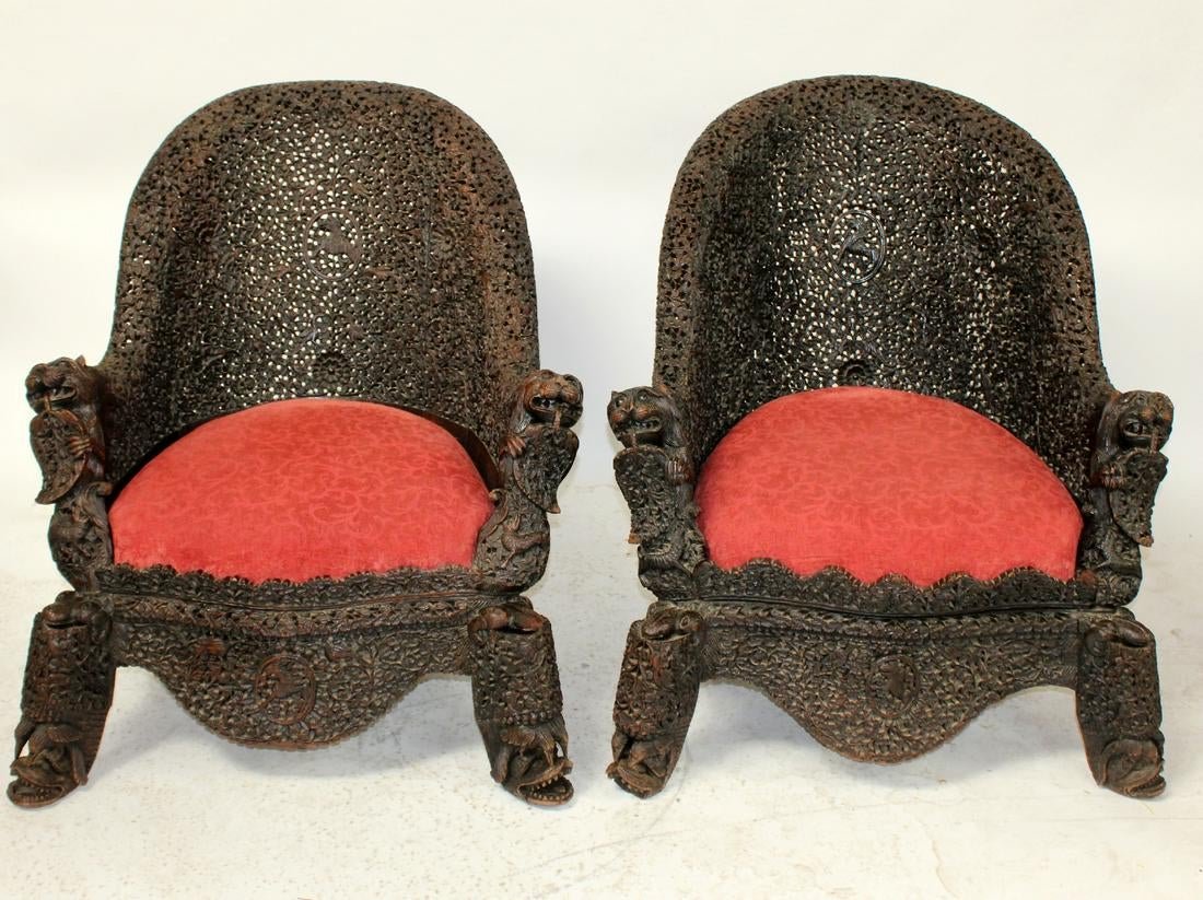Pair of antique carved Burmese chairs: Pair of antique floral pierce carved Burmese chairs. 19th century. 36"h x 30"w x 24"d