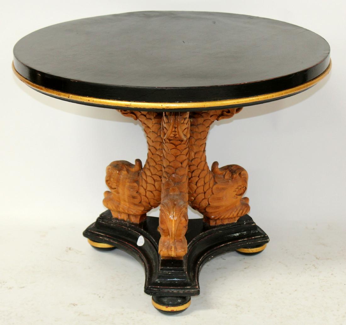Triple mythological dolphin base gueridon table: Triple mythological dolphin base gueridon foyer table in carved wood with ebonized top. 20th century. 22"h x 28" dia