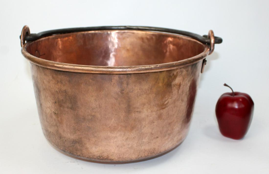 French copper pot with iron handle: French copper pot with iron handle. 9 1/4"h overall x 15"w overall x 13 1/2" pot diameter.