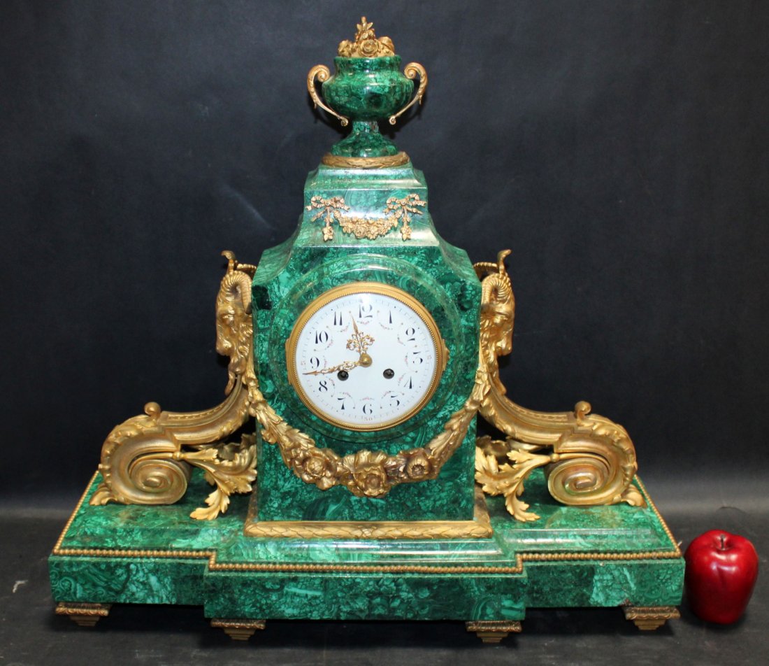 Empire style dore bronze & malachite clock with rams: French, Empire style dore bronze & malachite clock with rams's head mounts. Late 19th century. Movement marked with makers silver medal medallion 1855. Possibly Vicenti et Cie. 25"h x 25"w x 9 1/2"d