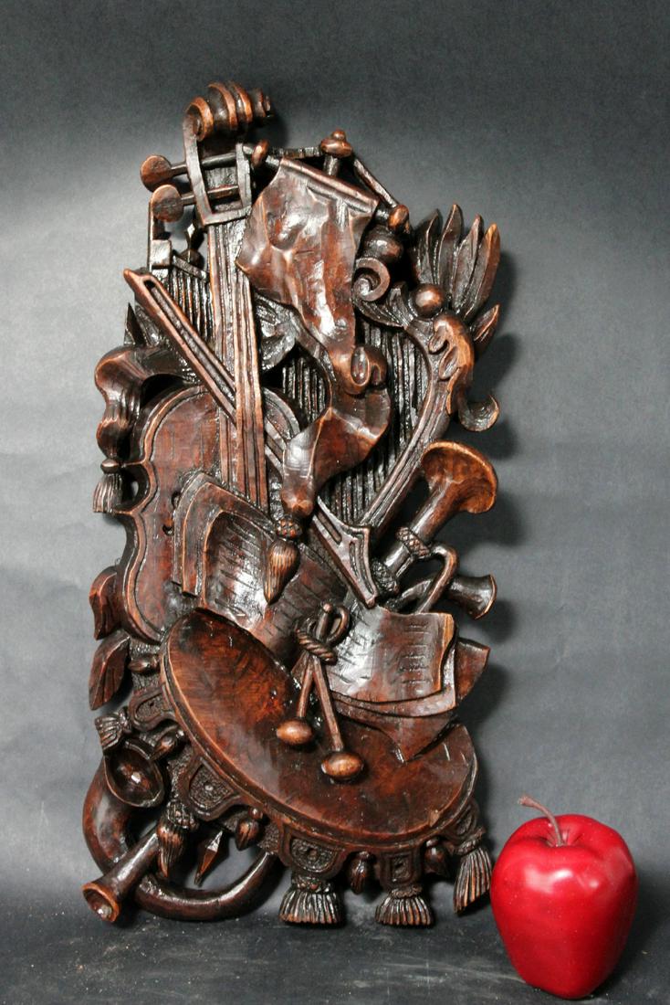 French walnut trophy plaque musical motif: French carved walnut trophy plaque in musical motif. Early 20th century. 19"h x 9 1/2"w