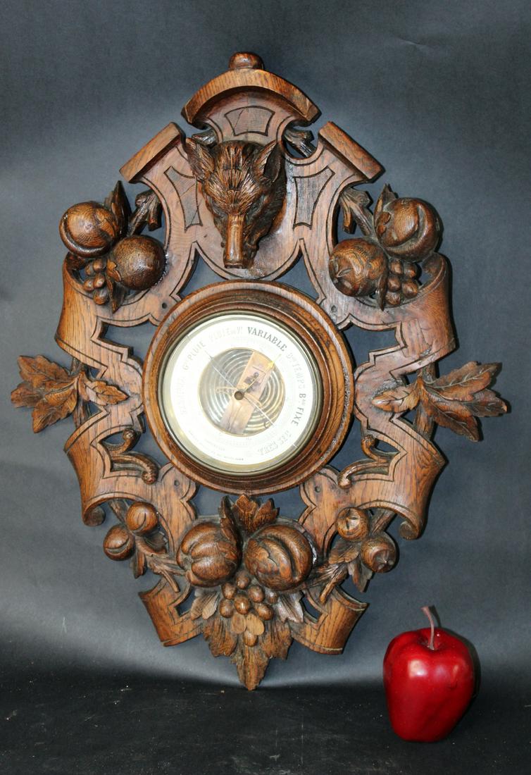French carved oak hunt motif barometer: French carved oak hunt motif barometer with fox head. Early 20th century. 22"h x 17 1/2"w