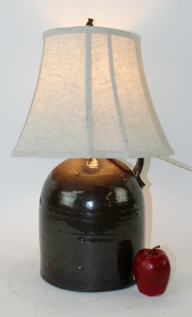American glazed pottery jug mounted as lamp (1 of 4)