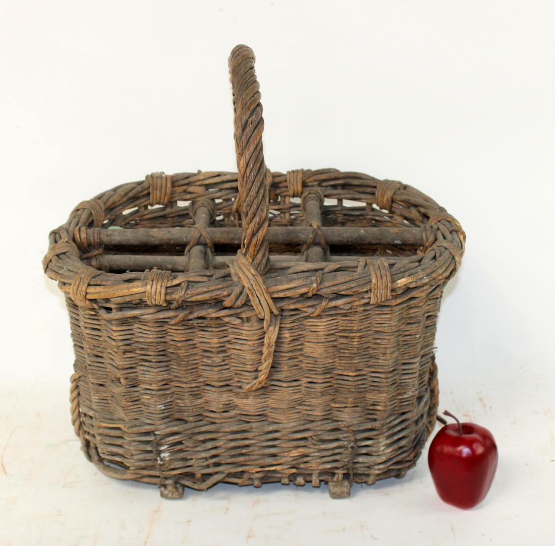French Provincial wicker wine bottle basket: French Provincial wicker wine bottle basket. Early 20th century. 22"h x 19"w x 15"d