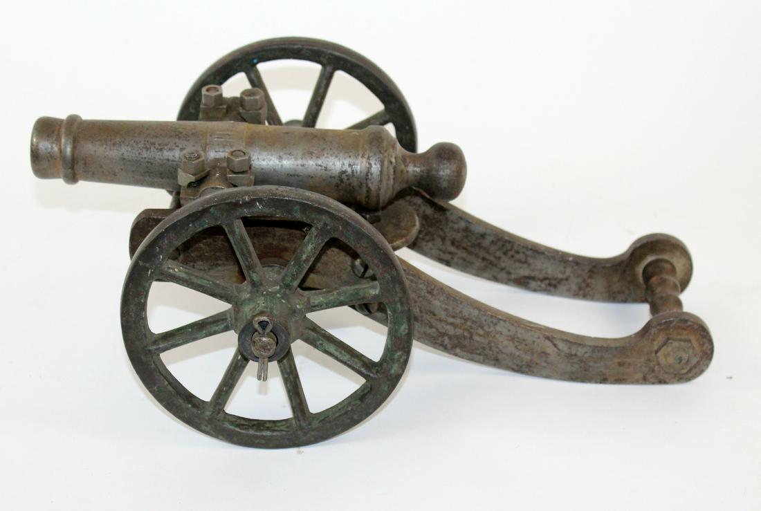 Continental table top cannon model in iron on iron (1 of 6)