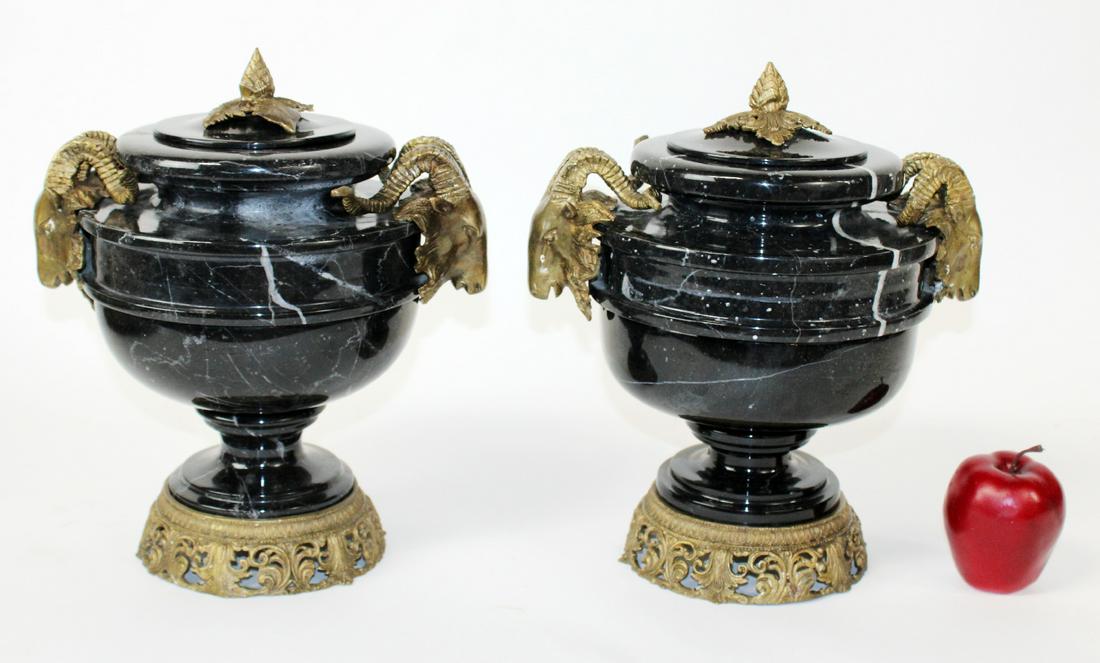 Pair of black marble lidded urns with ram heads (1 of 7)