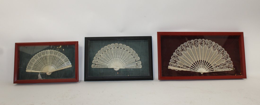Lot of 3 Chinese pierce carved bone fans: Lot of 3 Chinese pierce carved bone fans in shadow boxes. Framed sizes are 12"h x 18"w and 12 3/4"h x 23 3/4"w and 10 3/4"h x 16 3/4"w