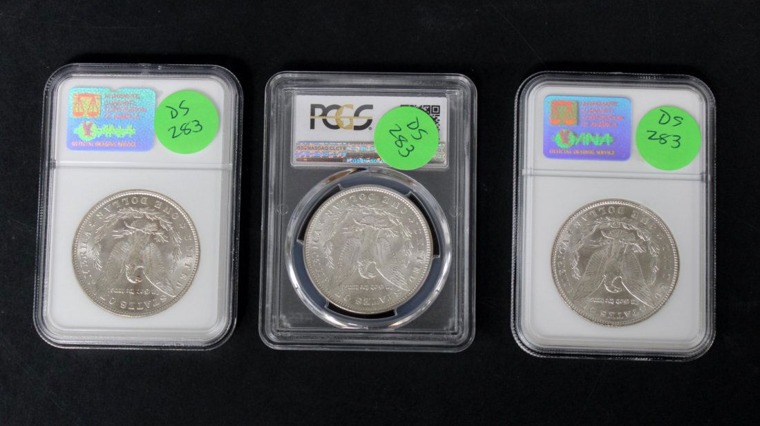 Lot of 3 Morgan silver dollars in collector's cases (1 of 4)
