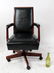 Black leather and mahogany swivel desk chair