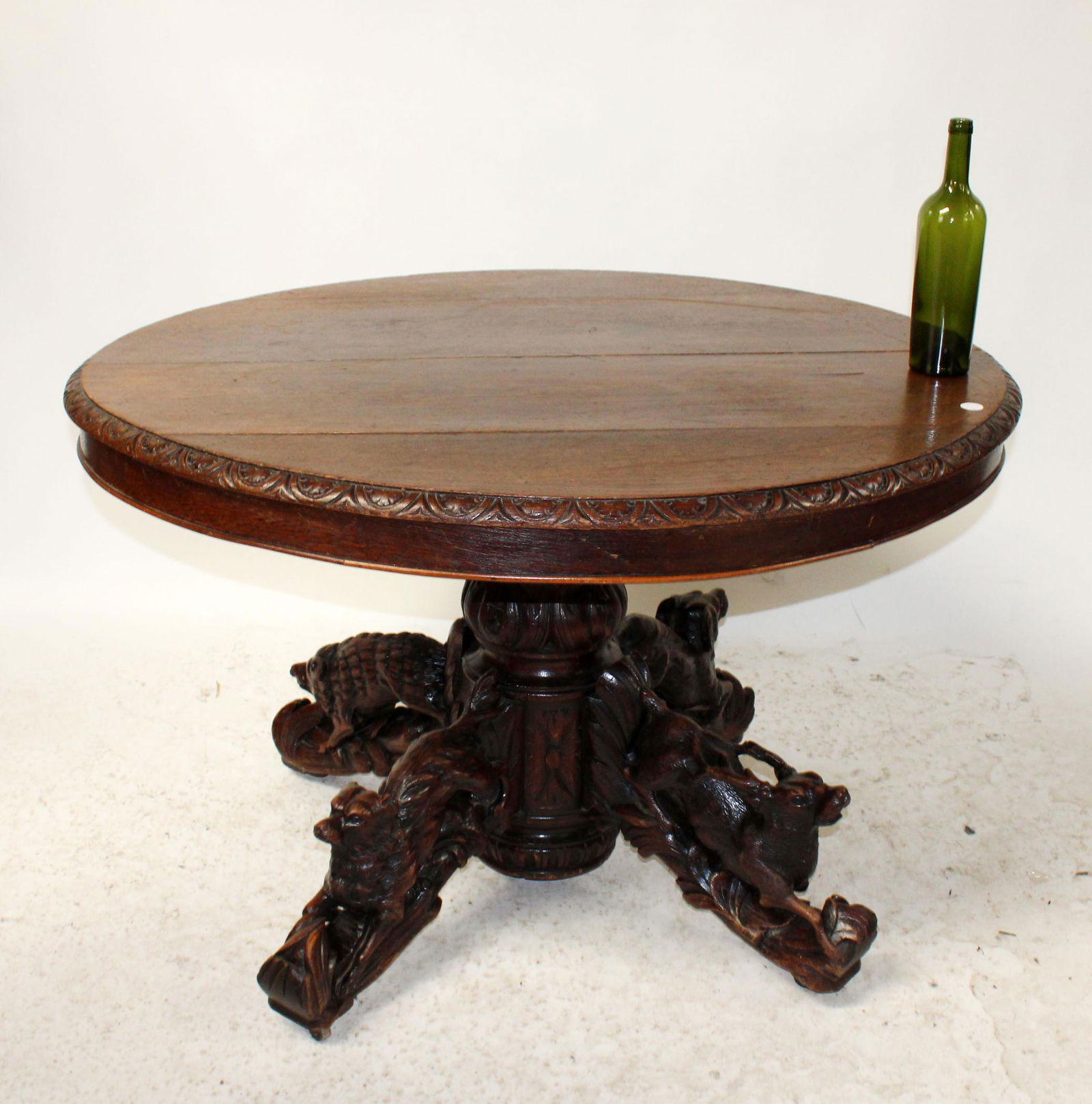 French table in carved oak. Base carved with game (1 of 8)