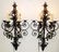 Pair of black wrought iron wall sconces