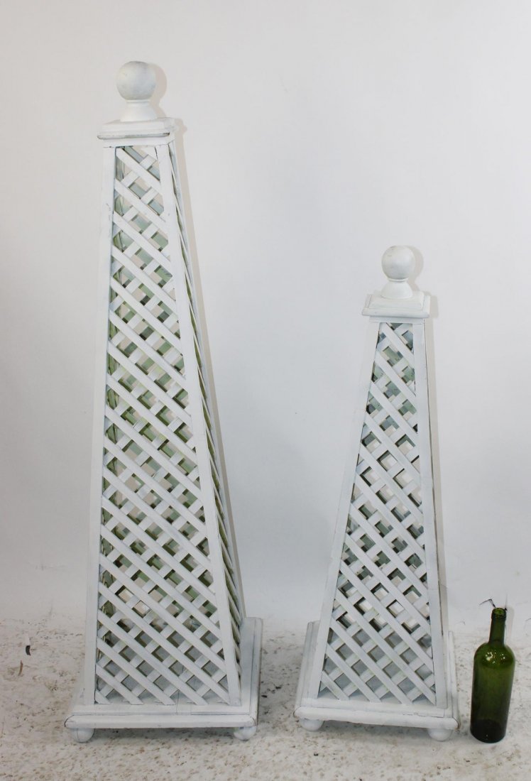Pair of painted white wooden obelisks: Pair of painted white wooden garden obelisks. 52"h x 14"w x 15"d, 39"h x 13" square at the base