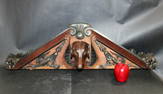 French carved walnut crest with dog head