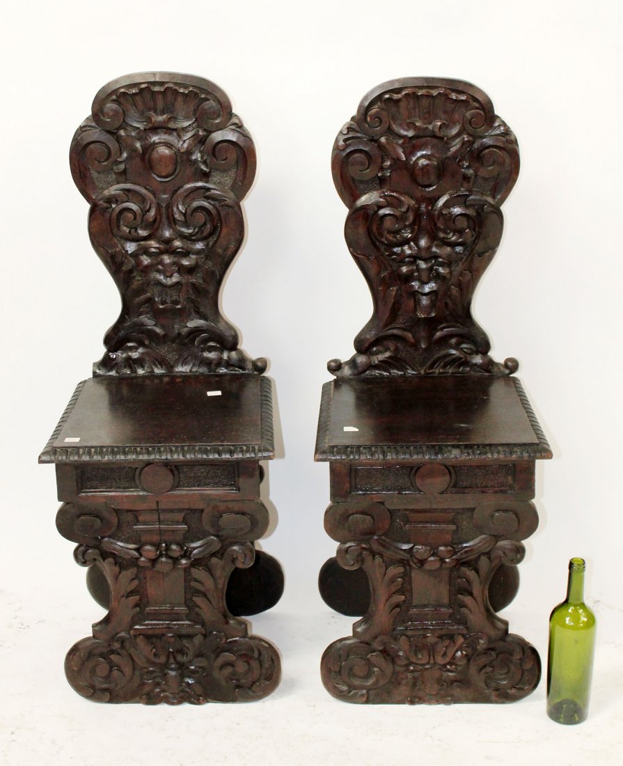 Pair of Italian Renaissance carved hall chairs: Pair of Italian Renaissance carved hall chairs with mythological masks. Late 19th century. 26 1/2"h x 24 1/4"w x 14"d
