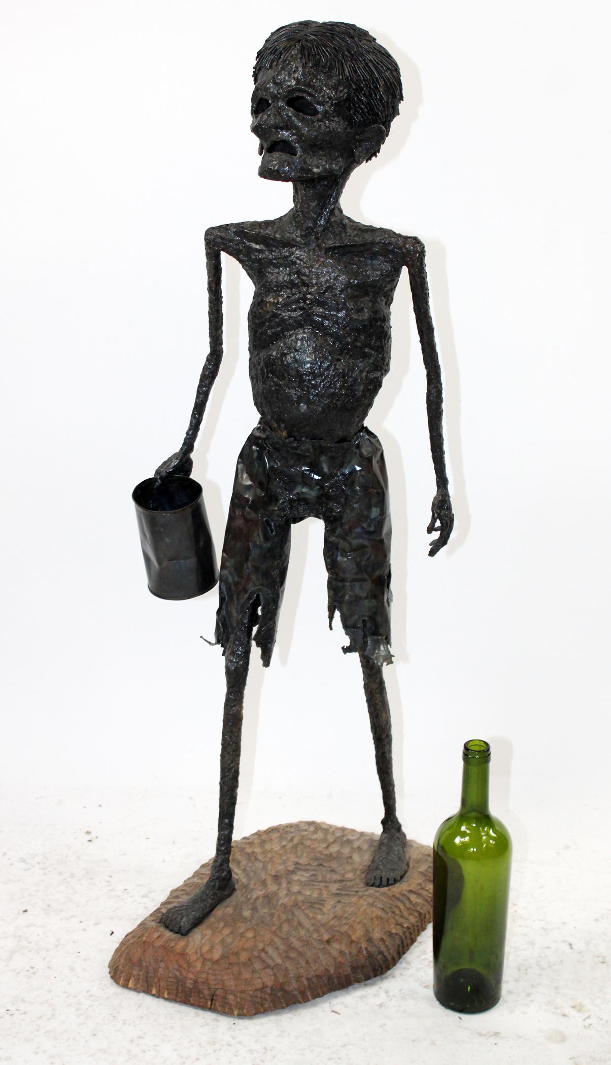 Iron figural sculpture on wooden base (1 of 10)