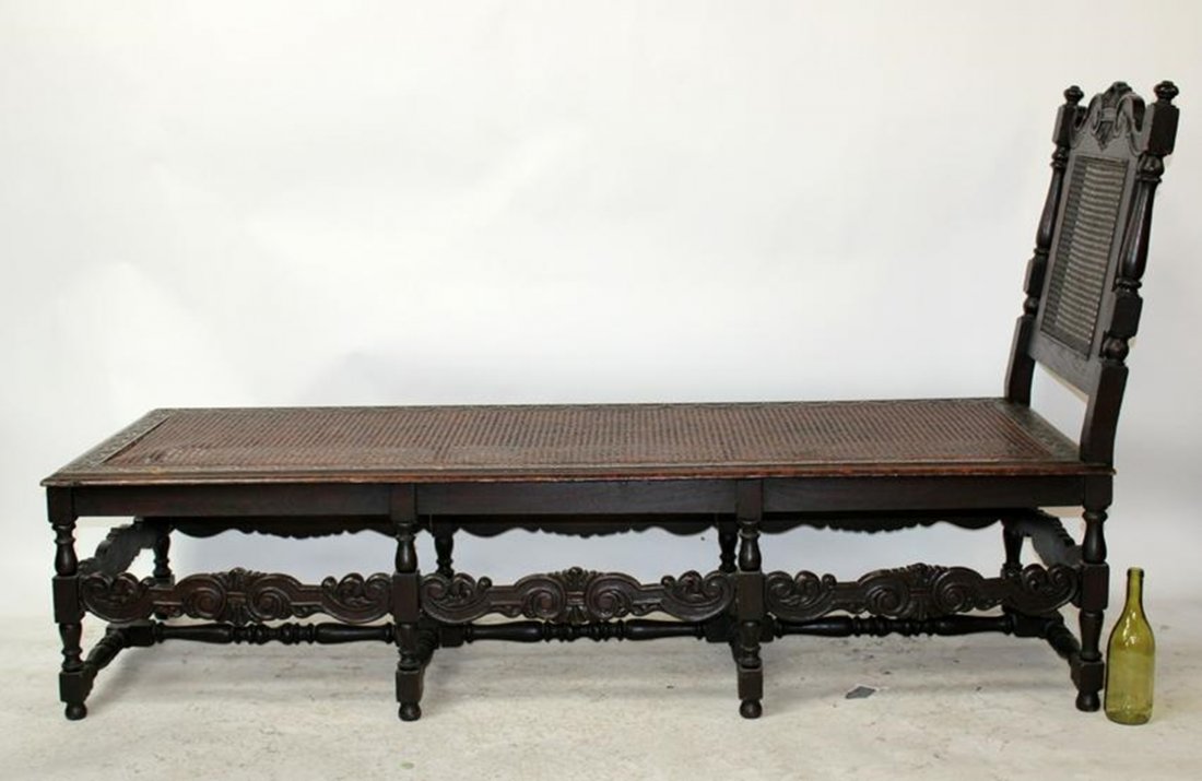 English oak & cane chaise longue: English oak & cane chaise longue. Late 19th century. 43"h x 73 1/2"l x 26 1/2"w