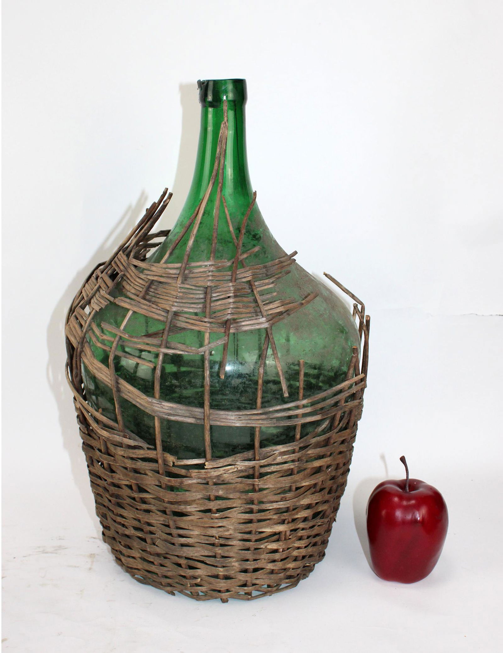 Glass demi john bottle in basket (1 of 4)