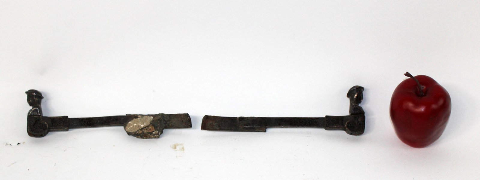 Pair of French iron figural shutter locks: Pair of French iron figural shutter locks. 19th century. Marked CTF. 9"l