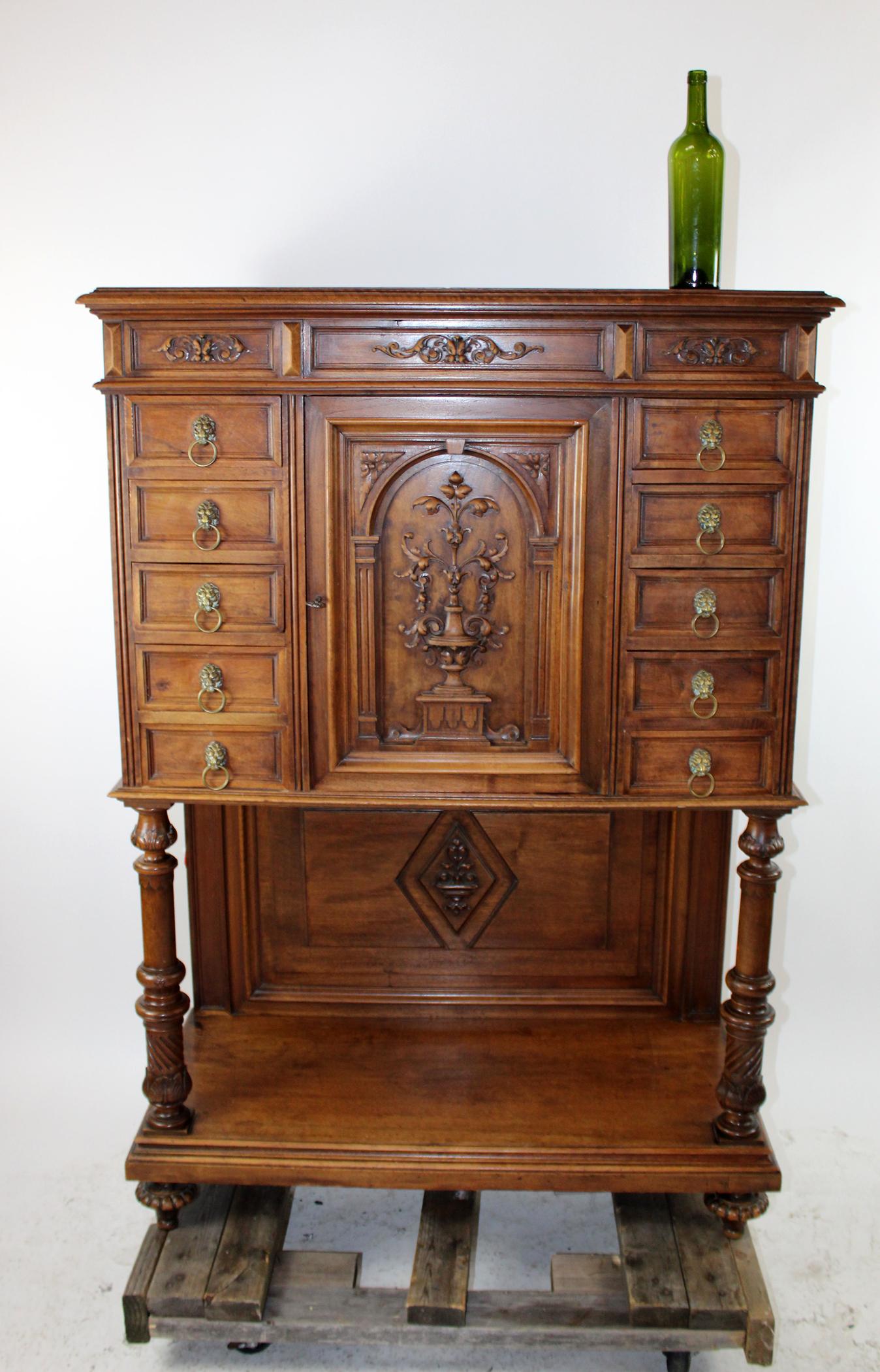 French Renaissance collector cabinet: French Renaissance collector'ss cabinet in walnut on legs. Late 19th century. 58 1/2"h x 41 1/4"w x 18 7/8"d