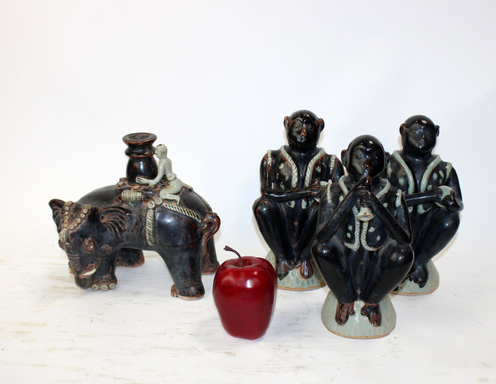 Lot of Glazed terra cotta monkeys and elephant: Lot of Glazed terra cotta monkeys and elephant. Late 20th century. Monkeys measure 10"h x 5"w and the elephant measures 8 1/2"h x 10"w