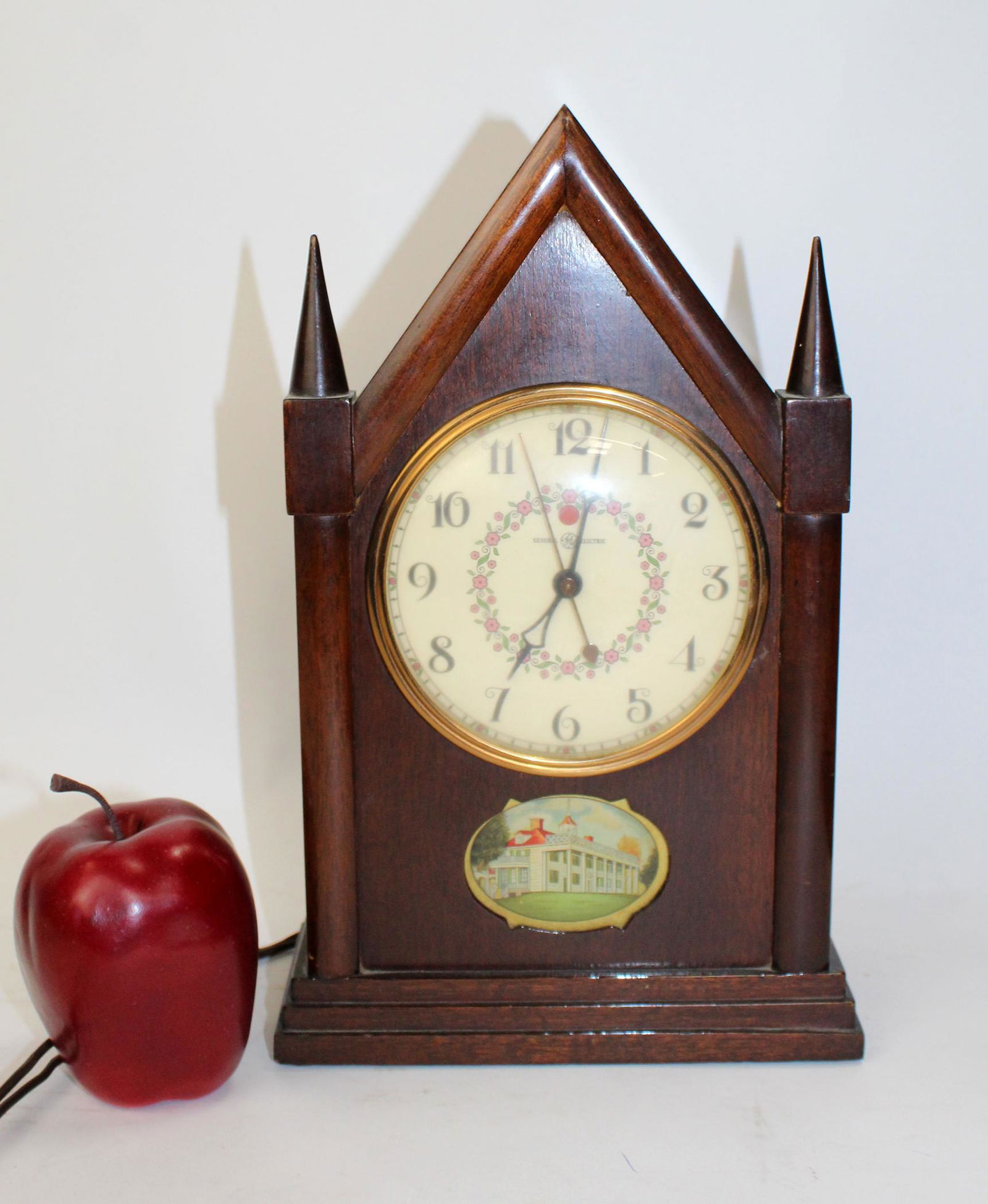 Vintage General electric mantel clock: Vintage General electric mantel clock in mahogany case. Electric movement. Mid 20th century.12"h x 7 1/2"w x 3 3/4"d