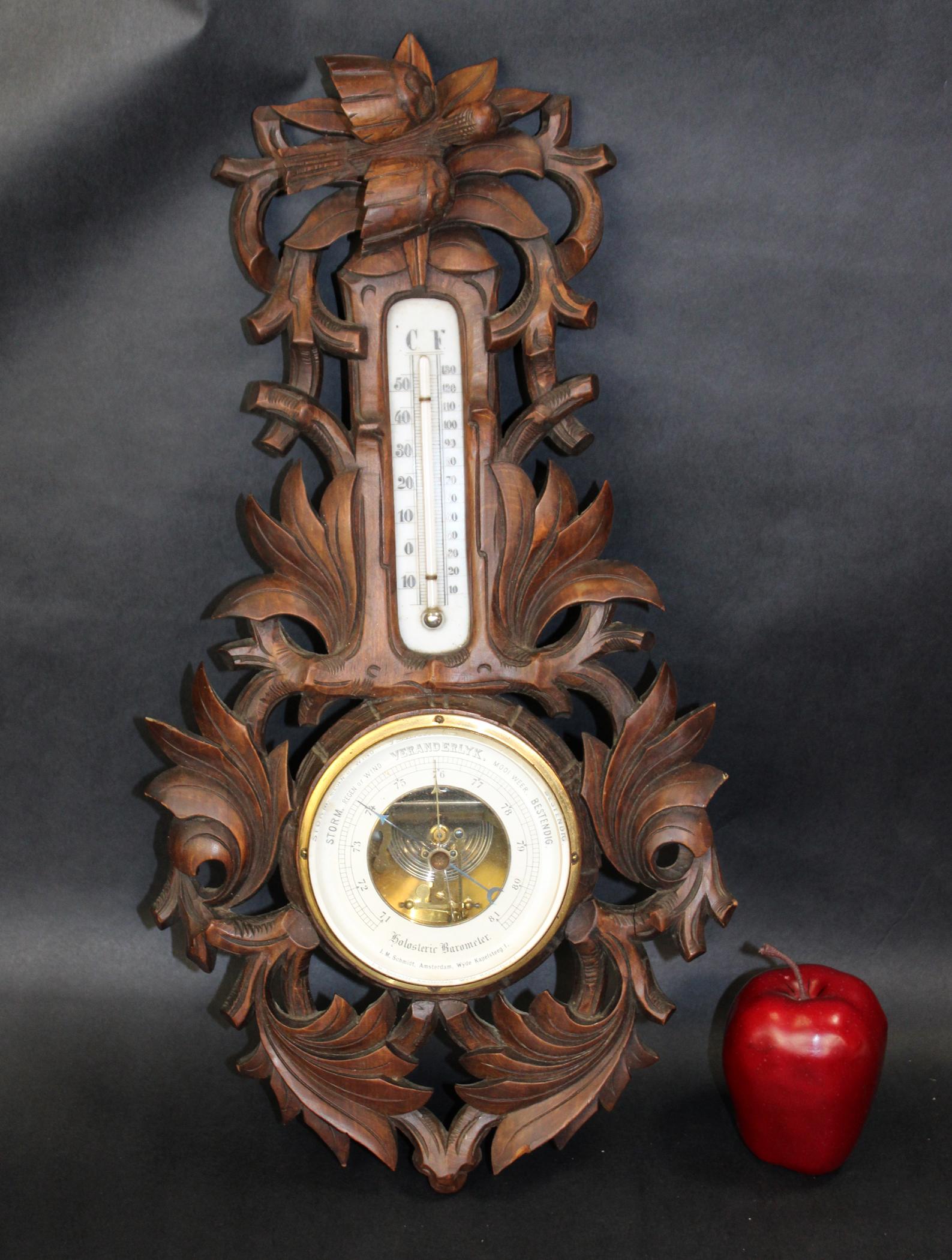 Dutch JM Schmidt barometer in carved walnut: Dutch JM Schmidt wall mount barometer in carved walnut with bird. Early 20th century. 21"h x 10"w