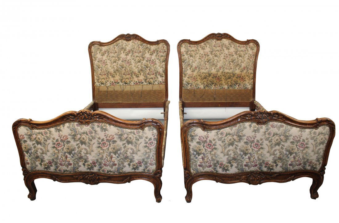 Pair French Louis XV style twin beds: Pair French Louis XV style twin beds with upholstered headboards and footboards with carved walnut frames. 50 1/2"h x 81"l x 45"w, inside 75"l x 41"w