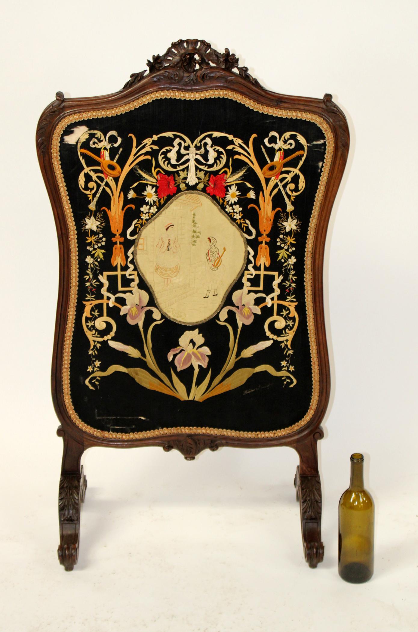 French Louis XV embroidered fire screen: French Louis XV embroidered fire screen in carved walnut. Embroidery signed lower right. Late 19th century. 44"h x 24"w x 14 1/2"d