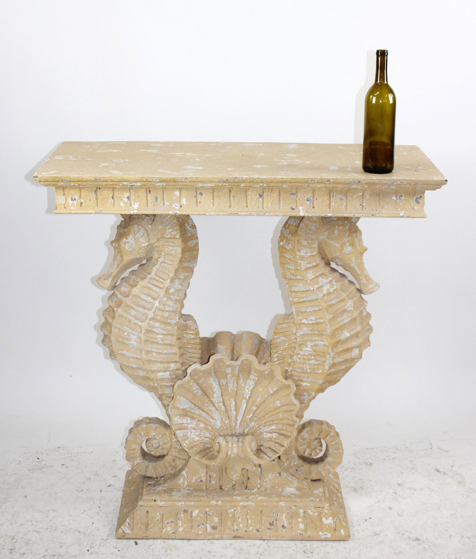 Double seahorse console table in plaster: Double seahorse console table in plaster over wood with shell. Distressed painted finish. Late 20th century. 38"h x 38"w x 18 1/2"d
