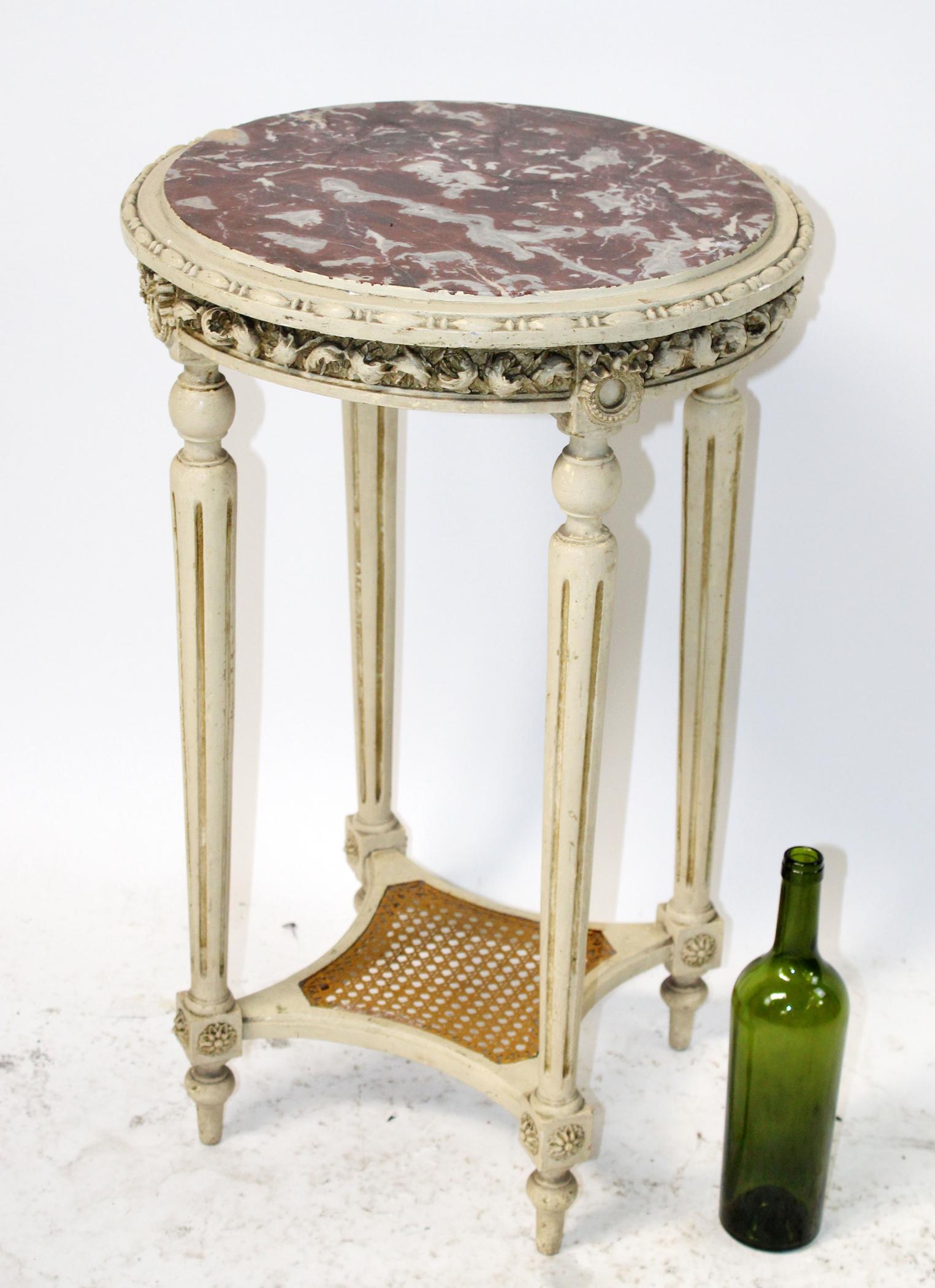 French Louis XVI style gueridon table: French Louis XVI style gueridon table with marble top. Early 20th century. 28 1/2"h x 17"dia