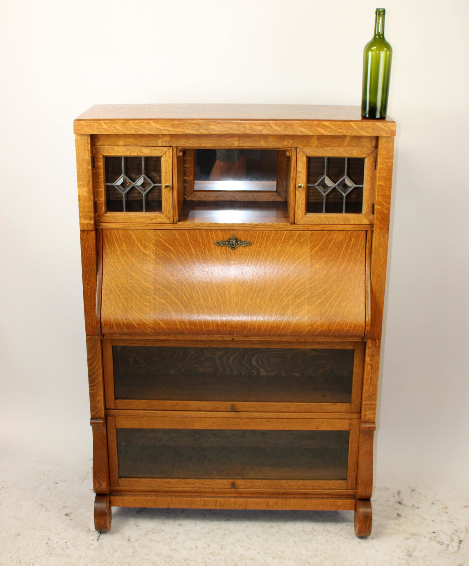American oak stacking bookcase with fall front: American oak stacking bookcase with fall front secretary and leaded glass upper door. Early 20th century. 54"h x 36"w x 14 1/2"d
