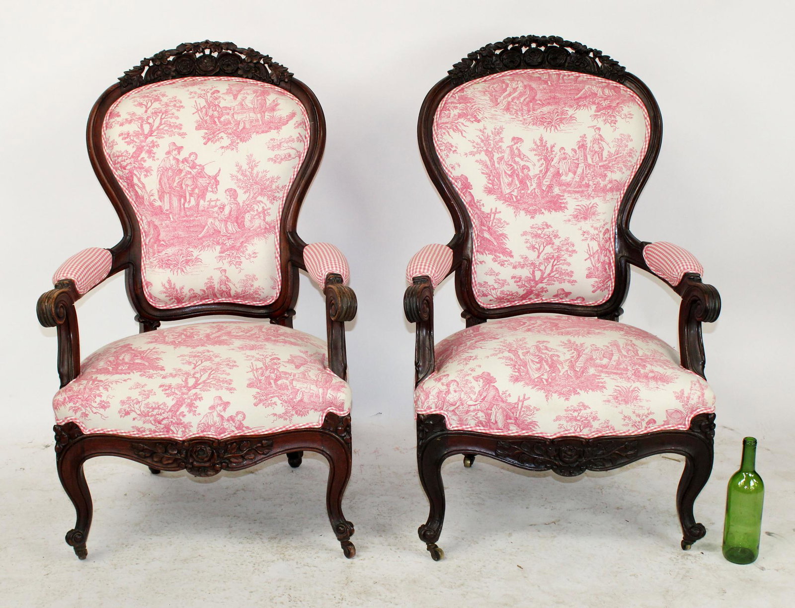 Pair American Victorian toile upholstered armchairs: Pair of American Victorian floral carved mahogany pink toile upholstered armchairs. 39 1/2"h x 26"w x 24"d