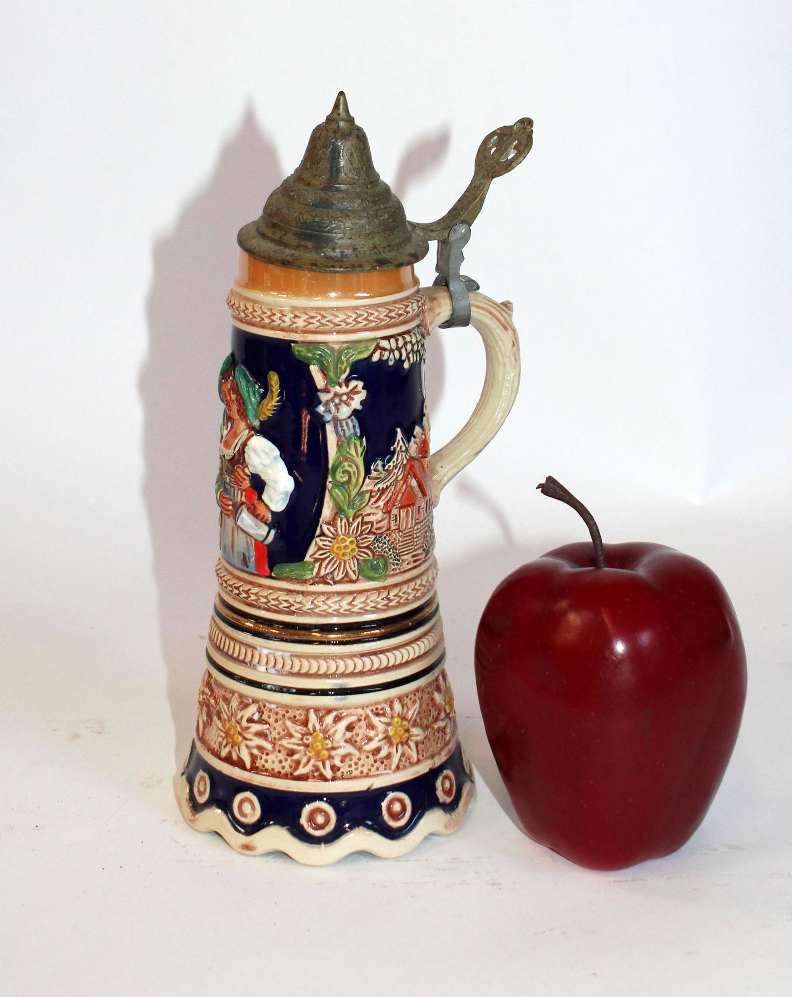 German minature beer stein with music box: German minature beer stein with music box. 20th century. 9"h x 4" dia