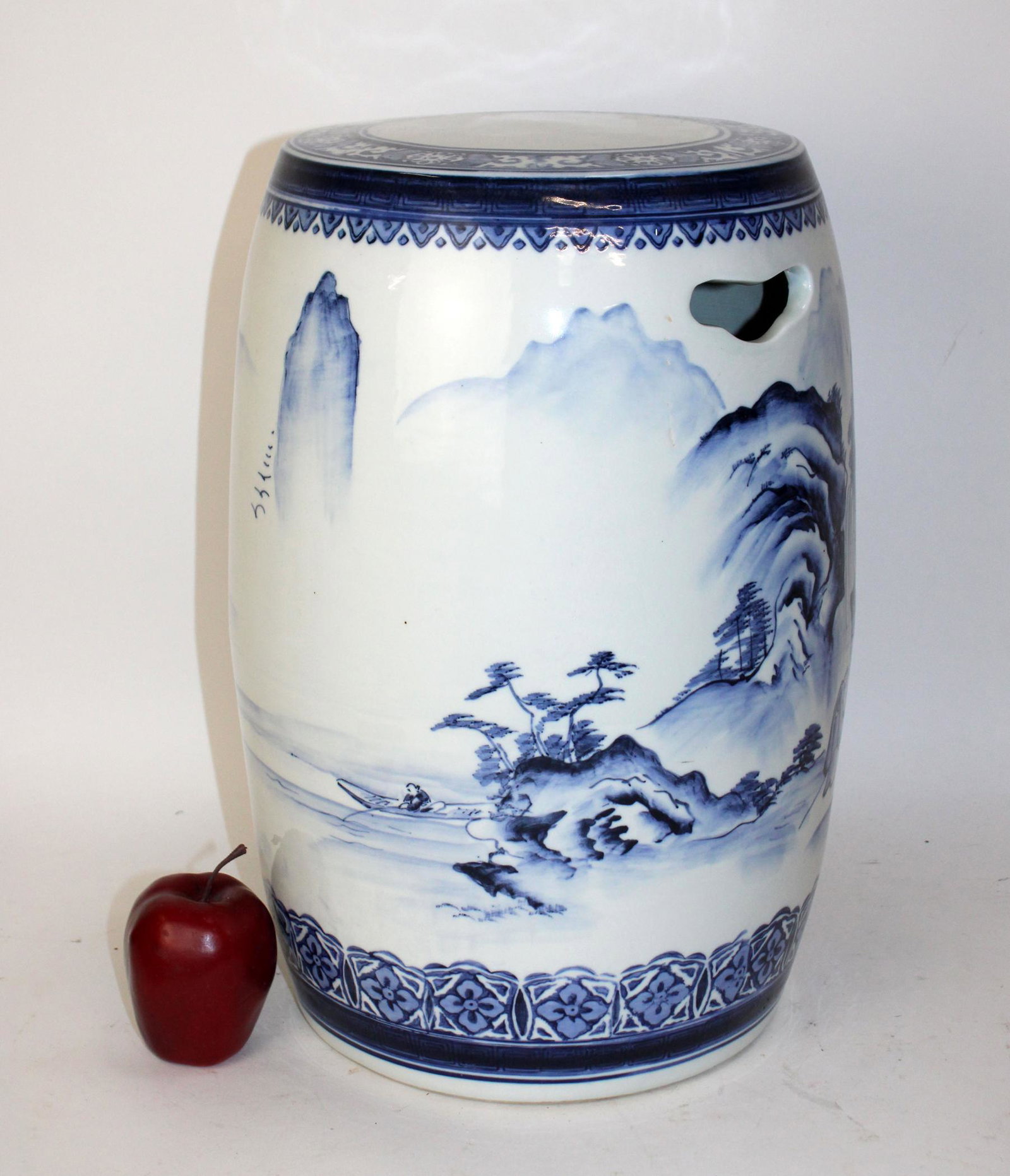 Chinese blue and white porcelain garden seat: Chinese blue and white porcelain garden seat with landcspae scenes. Late 20th century. 18"h x 11" dia