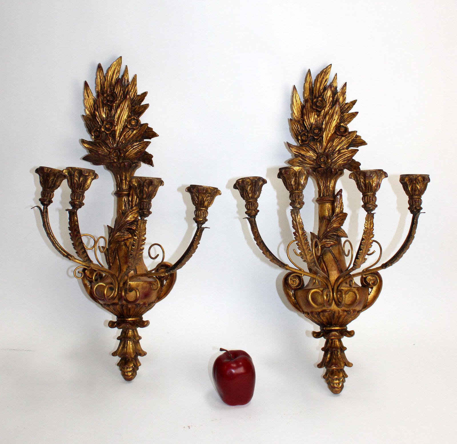 Pair of cast urn form candle sconces: Pair of cast urn form candle sconces in gold painted finish. Late 20th century. 25"h x 15"w x 11"d