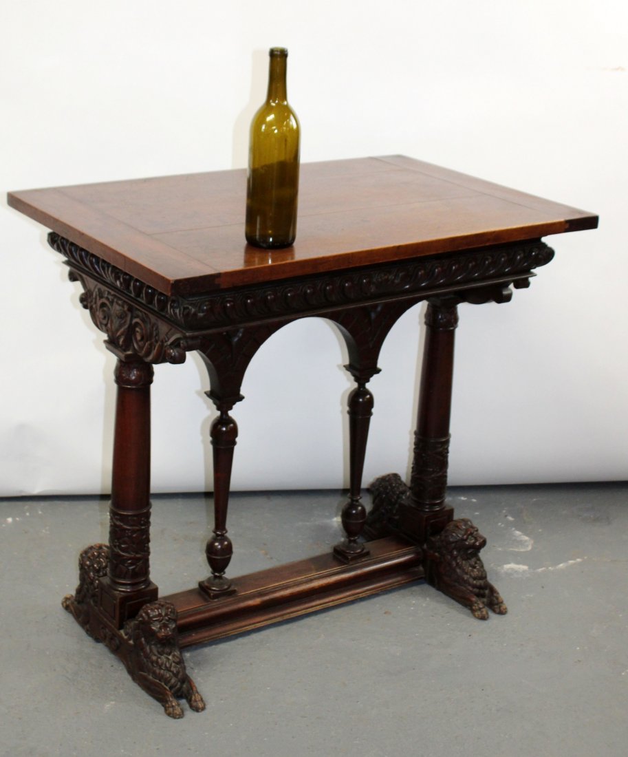 French Renaissance table in walnut with laying lions: French Renaissance table in walnut with laying lions and columned base. 19th century. 29 1/2"h x 32 3/4"w x 21"d