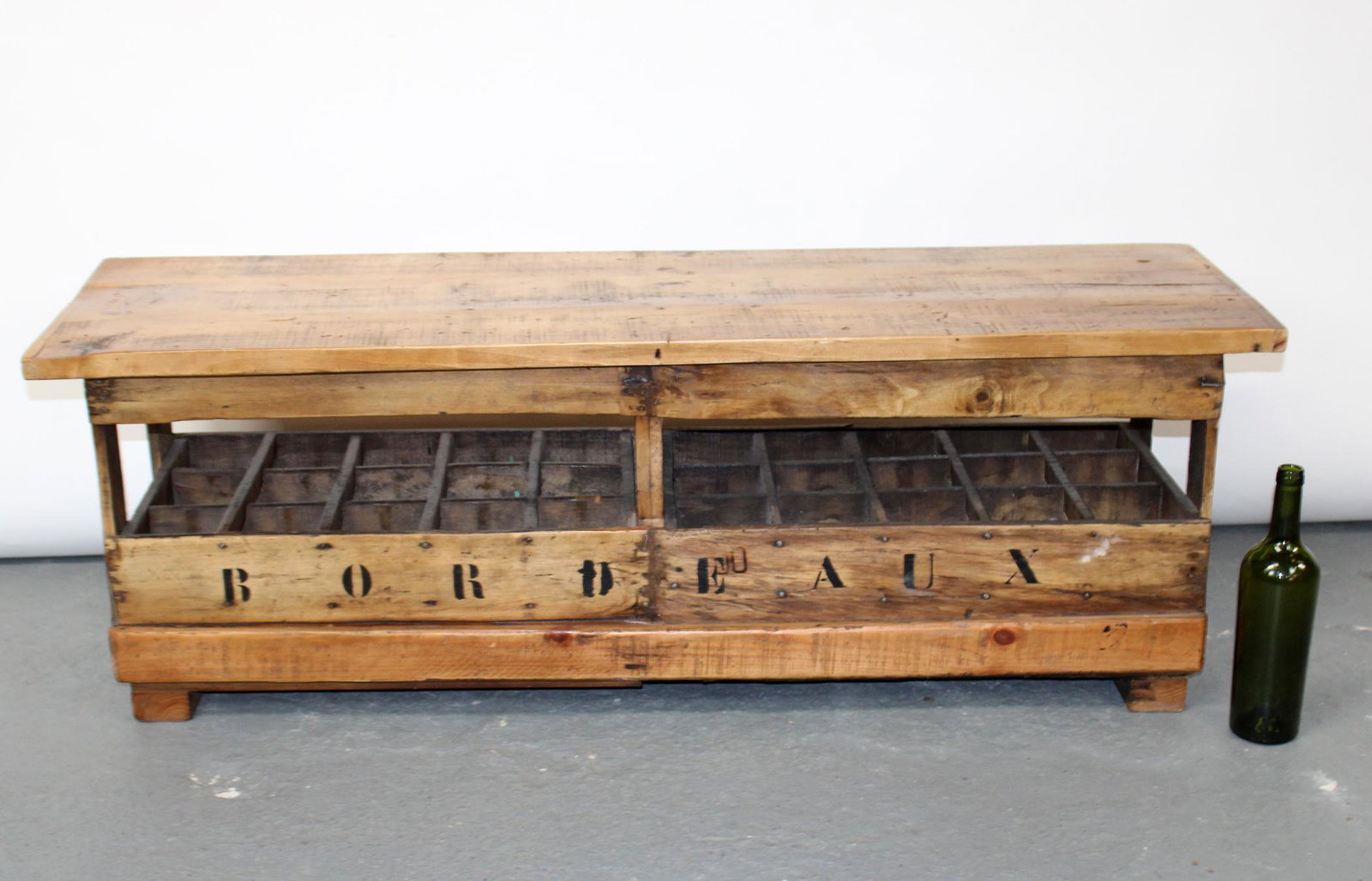 French double wine crate bench: French double wine crate bench with lift top. Marked Bordeaux. 20th century. 17 3/4"h x 50"w x 14 1/4"d