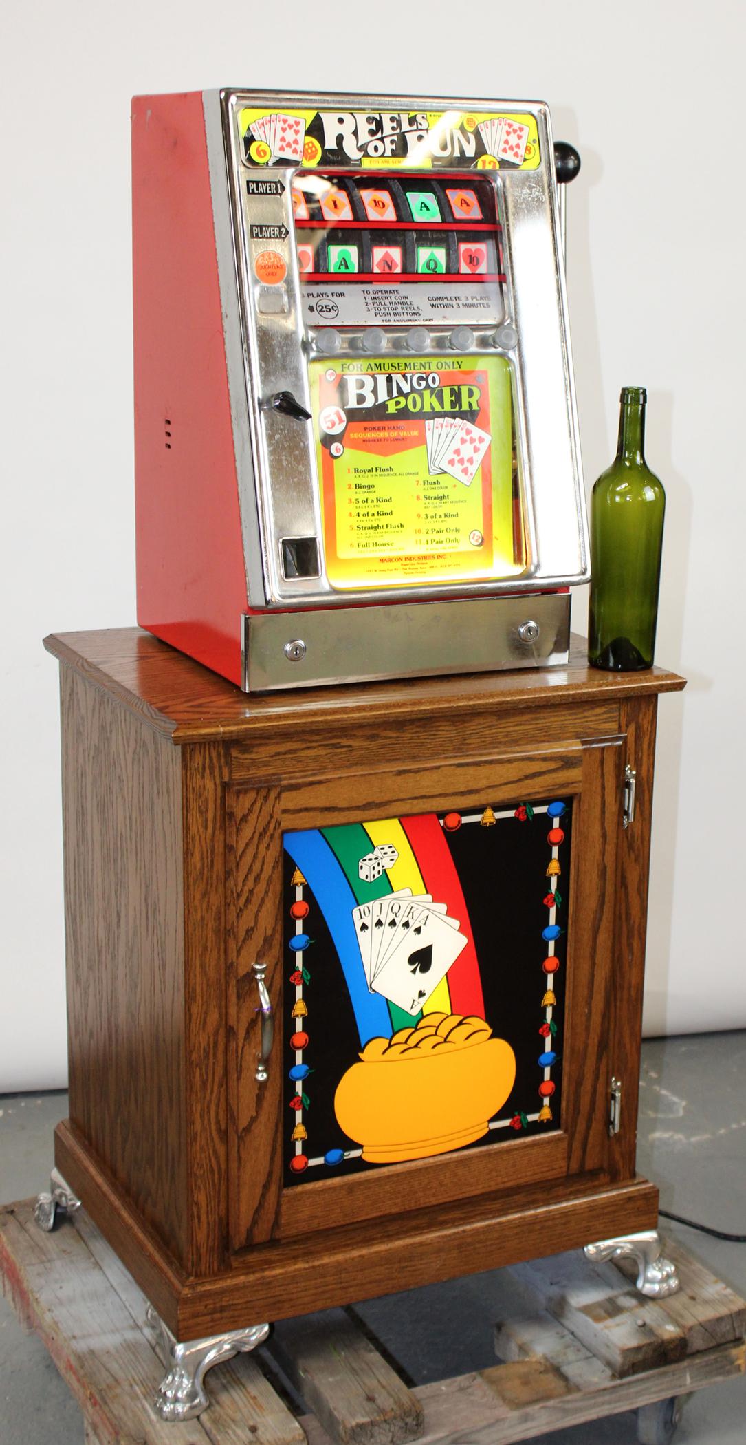 Antique Reels of Fun bingo poker game: Antique Reels of Fun bingo poker game on lighted oak cabinet. *Sold as novelty or for parts- Not in working order* *Buyer is responsible for knowing individual state laws and regulations* Machine 23 1