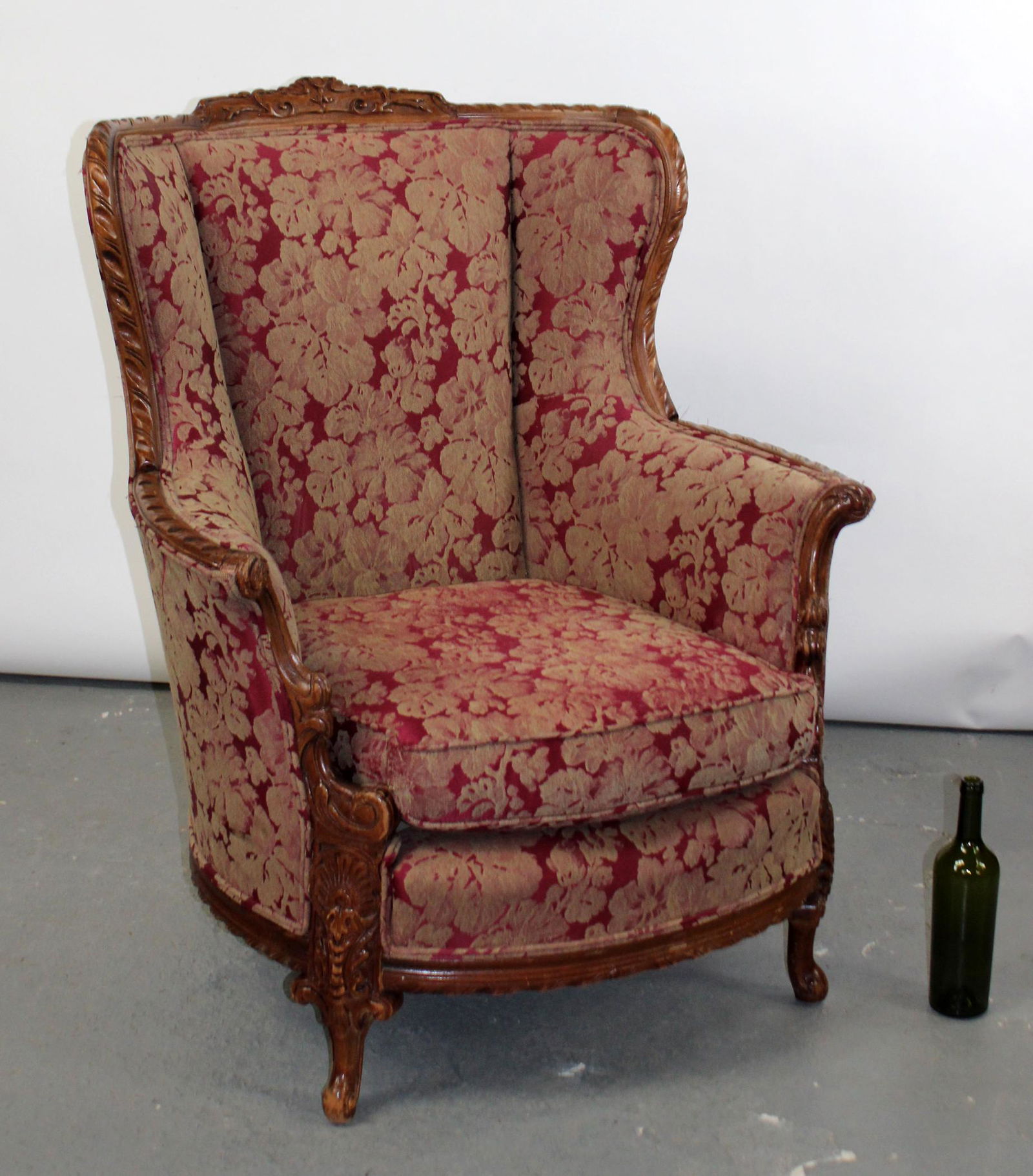 Carved wingback armchair with floral upholstery (1 of 8)