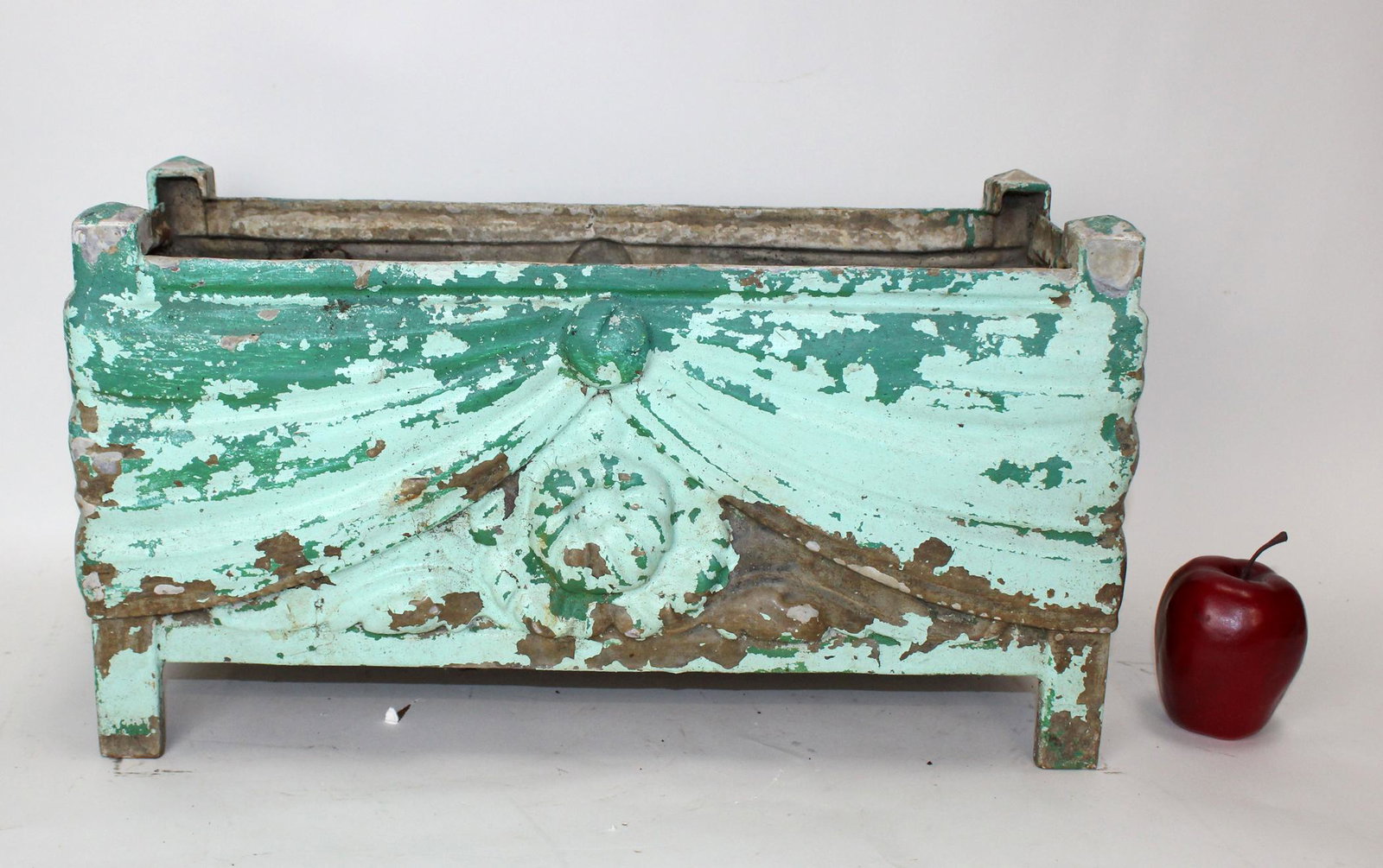 Antique French cast iron garden planter: Antique French cast iron garden planter decorated in relief with curtain swags. Circa 1900. 10 5/8"h x 19 5/8"l x 8 1/8"w