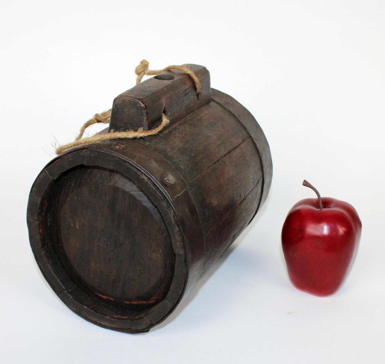 Antique French tonnelet (mini wine barrel): Antique French tonnet (mini wine barrel) with rope handle. In oak with forged iron band and nails. Each side carved with initials LP. Early 20th century. 8"h x 8 1/4" l x 6"w