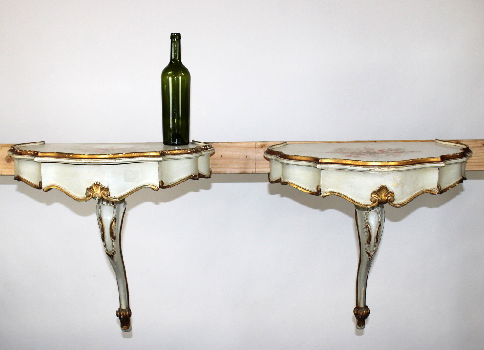 Pair of Venetian painted wall mount consoles: Pair of Venetian painted wall mount console tables. Floral painted tops. Mid 20th century. 23"h x 13 1/2"w x 11 1/4"d