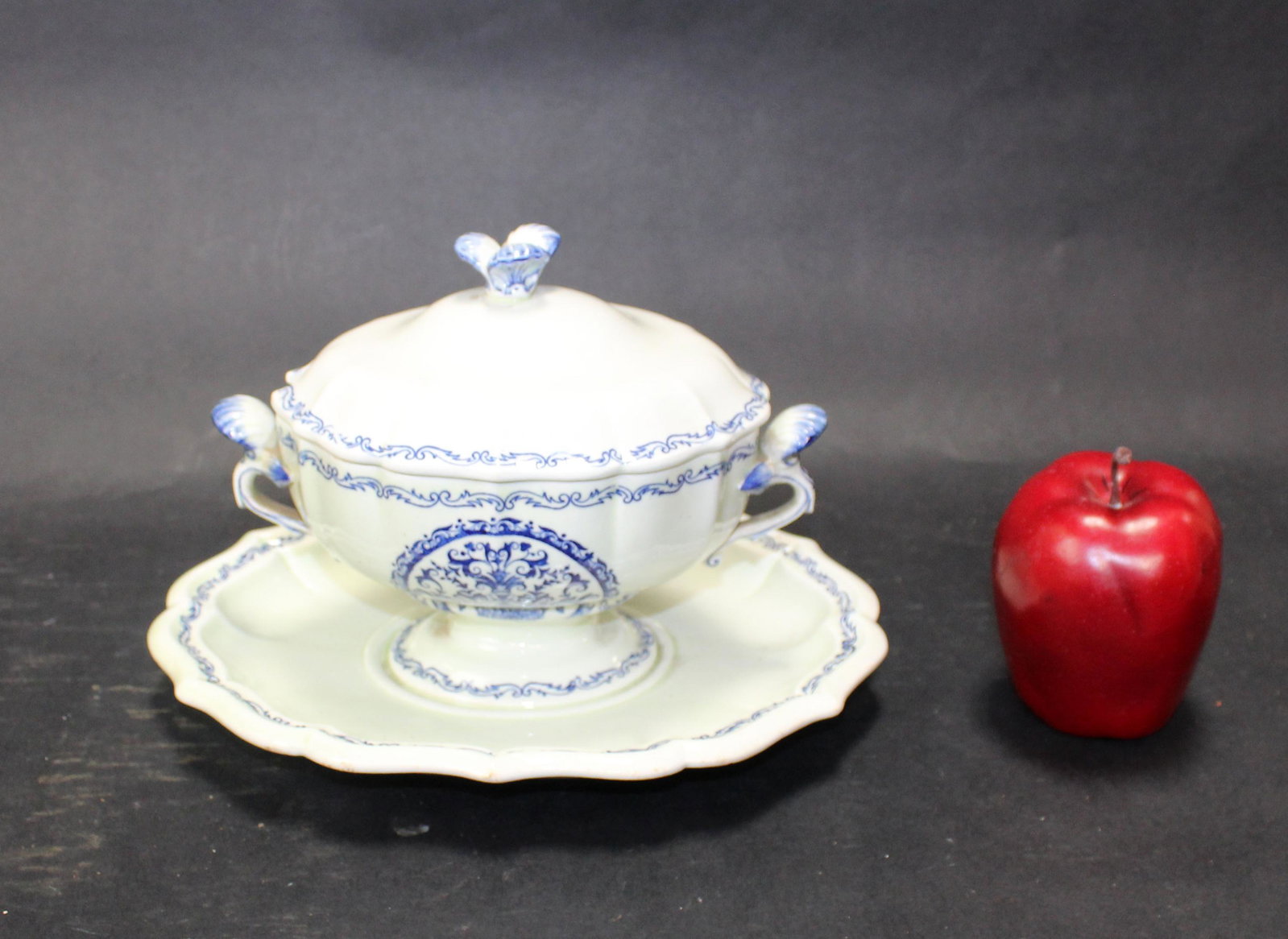 French blue and white earthenware gravy boat: French blue and white earthenware gravy boat. Mark on the bottom. 7"h x 10"w x 8"d
