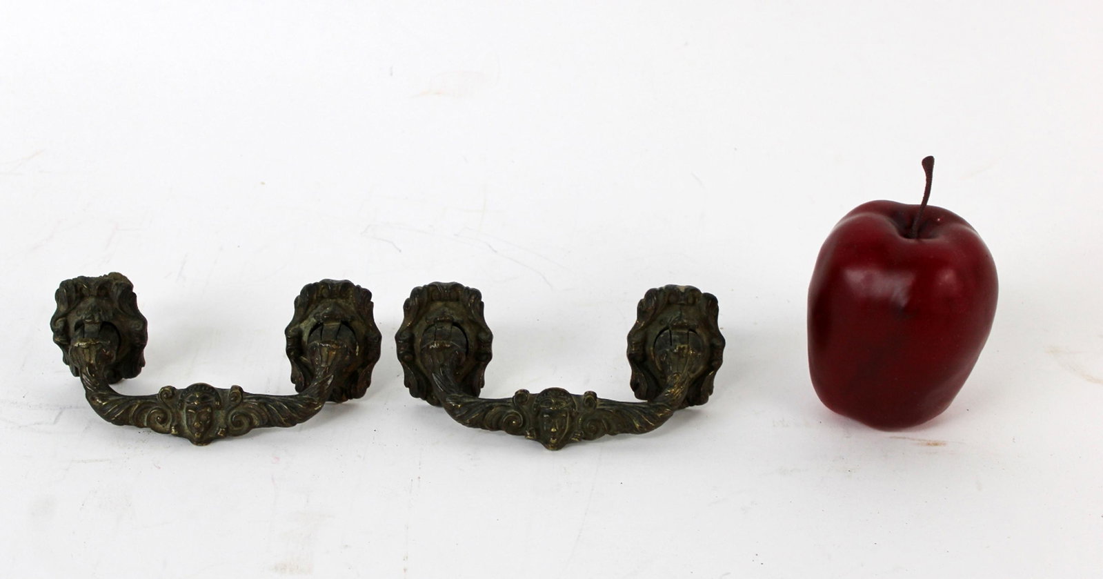 Pair of French bronze figural drawer pulls: Pair of French bronze figural drawer pulls. Late 19th century. 2 1/2" x 5 3/4"w overall, 4 1/4" width between screws.