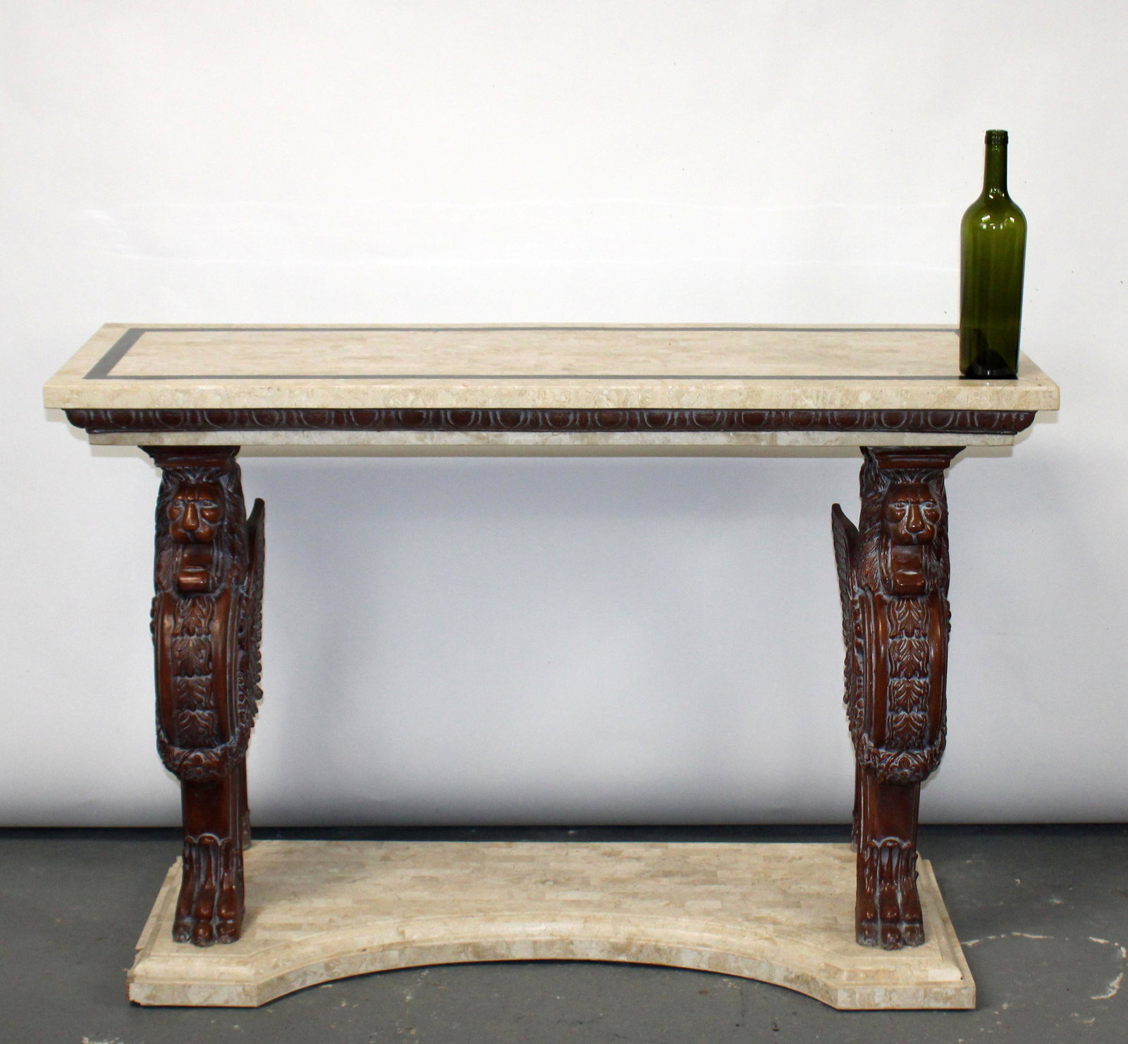 Tessellated marble top console with winged griffin: Tessellated marble top console with winged griffin supports. Late 20th century. 32 1/2"h x 48"w x 17"d