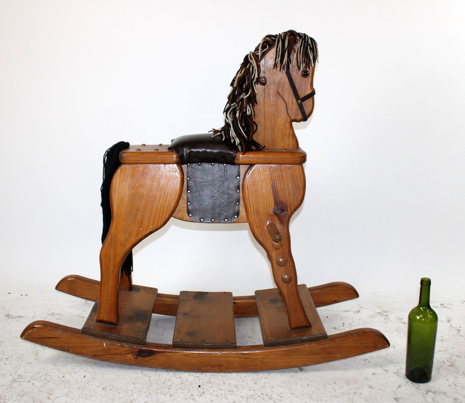 American vintage pine wooden rocking horse: American vintage pine wooden rocking horse with yarn mane. 40"h x 42"l x 16"w