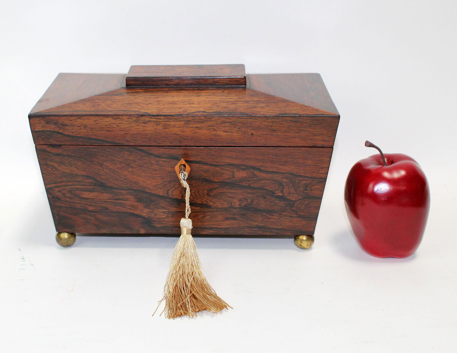 Antique English Rosewood tea caddy: Antique English Rosewood tea caddy on ball feet. Replaced interior container. 6 1/2"h x 10 1/2"w x 6"d
