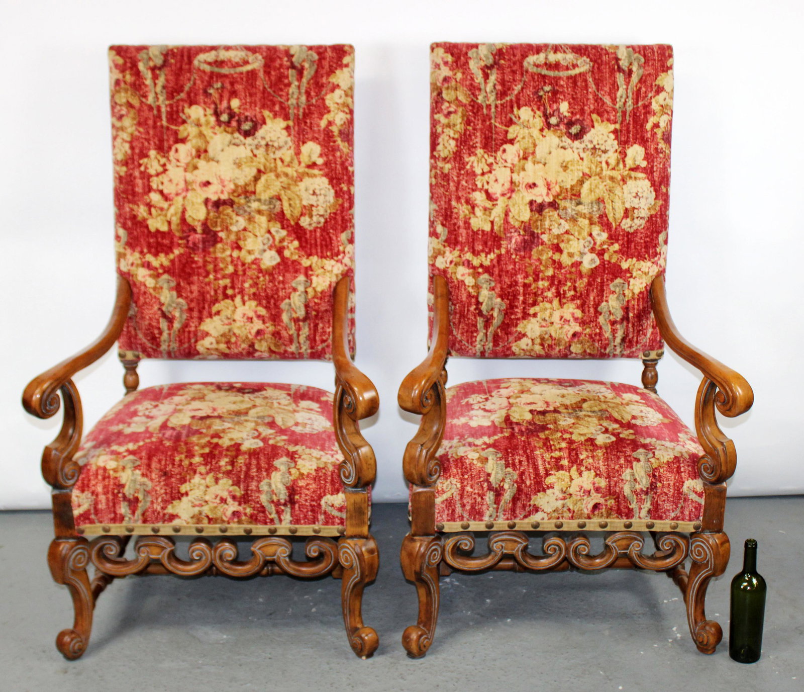 Pair of French Louis XIV style armchairs: Pair of French Louis XIV style armchairs upholstered in red and gold fabric. Late 20th century. 52"h x 30"w x 30"d, seat height 19 1/2"h