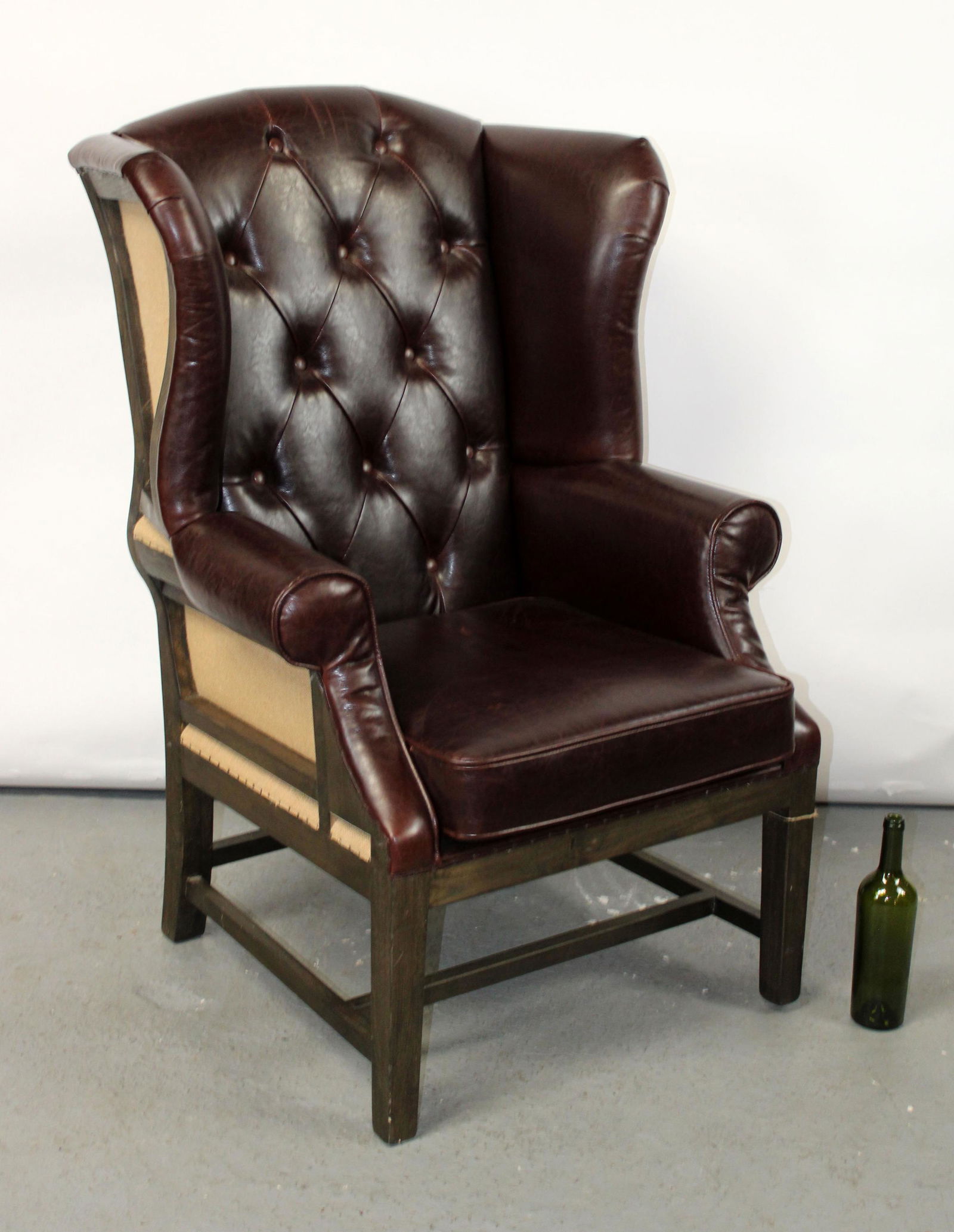 Tufted leather wing back armchair (1 of 7)