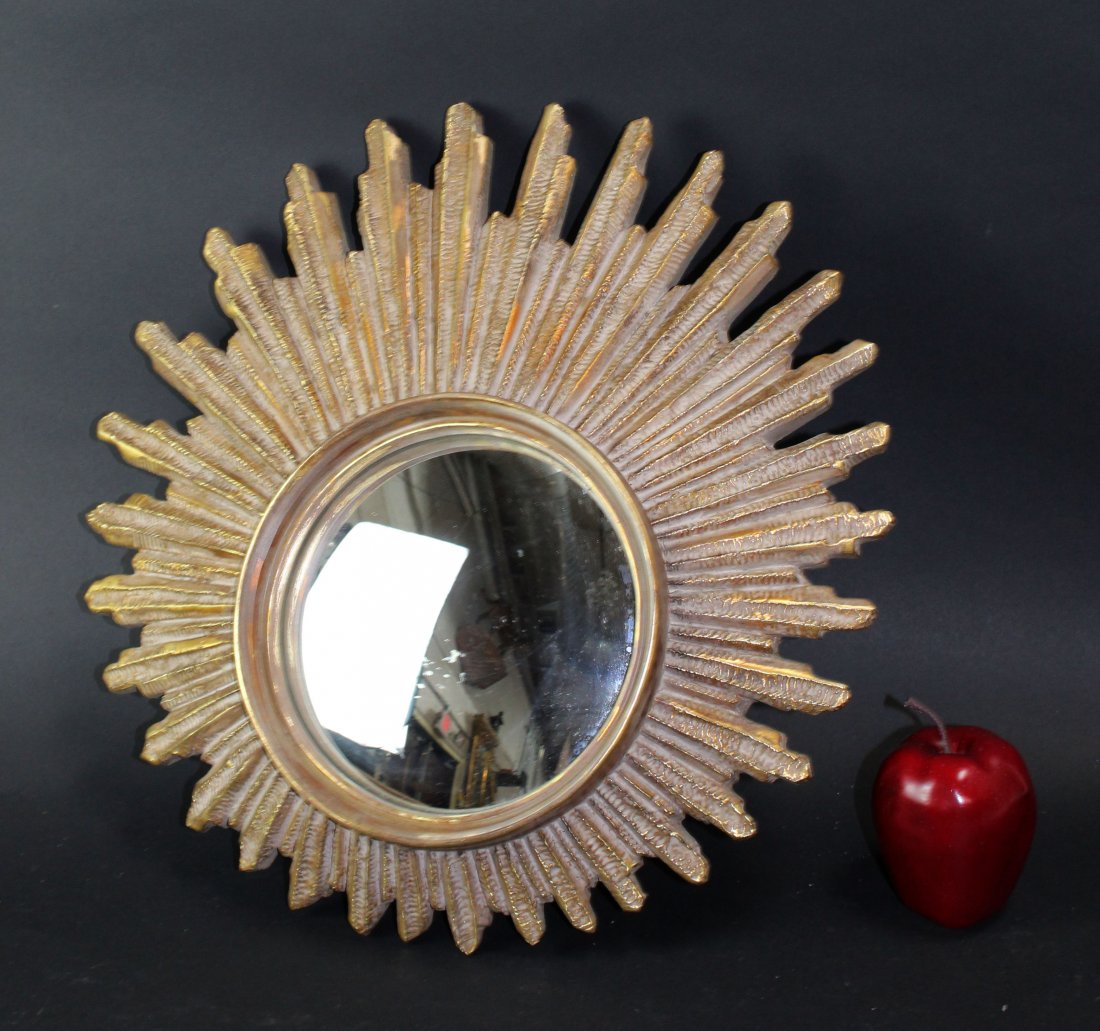 French asymmetrical sunburst mirror with convex glass: French asymmetrical sunburst mirror with convex glass. Circa 1980’s18"h x 17 1/2" w